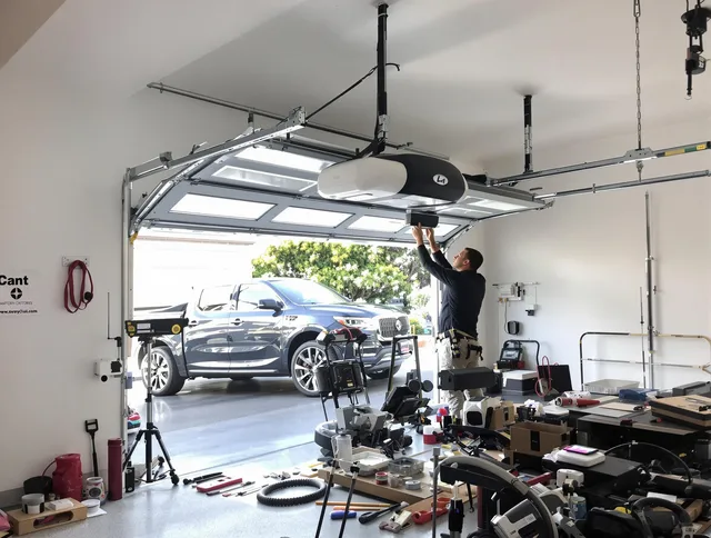 Lakeland Garage Door Repair specialist installing smart garage door opener system in Lakeland home