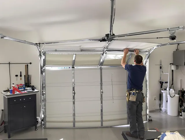 Lakeland Garage Door Repair specialist performing precise section replacement on Lakeland garage door